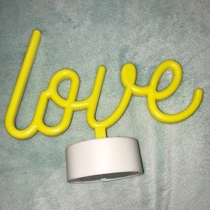 “Love” neon sign 🦋